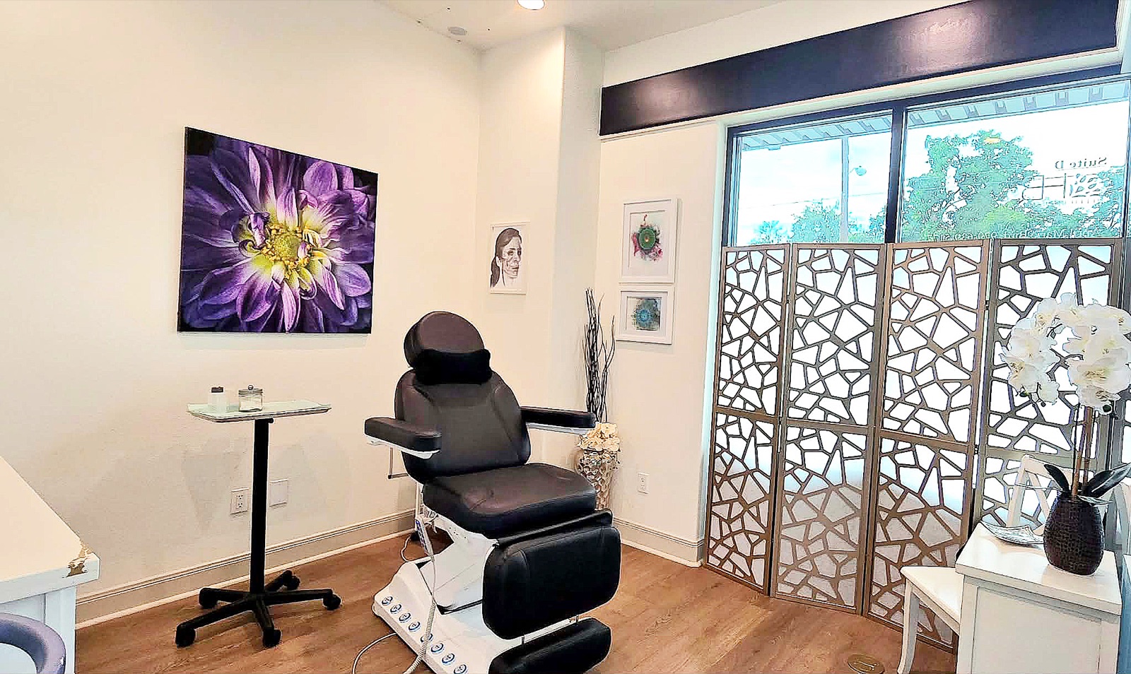 Laser treatment room at Hello Beautiful with a treatment chair and natural light